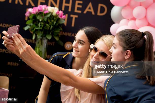 Paris Hilton poses for selfies with fans during a promotion visit to Australia to launch her 23rd fragrance, Rosé Rush on November 30, 2017 in...