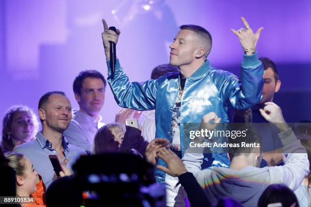 Macklemore, aka Benjamin Hammond Haggerty performs during the 1Live Krone radio award at Jahrhunderthalle on December 07, 2017 in Bochum, Germany.