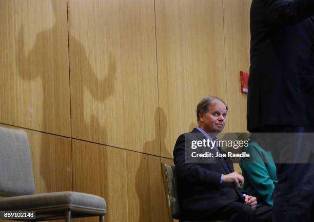 Democratic Senatorial candidate Doug Jones looks on as Sen. Cory Booker speaks during a campaign event held at Alabama State University at the John...