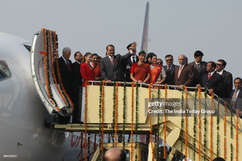 Praful Patel, Union Cabinet Minister for Civil Aviation pauses with Air India air hostesses with their new uniform during the delivery of the Boeing 737-800 Commercial Jetliner for Air India in New Delhi, 06 November 2006. Air India celebrated the deliver
