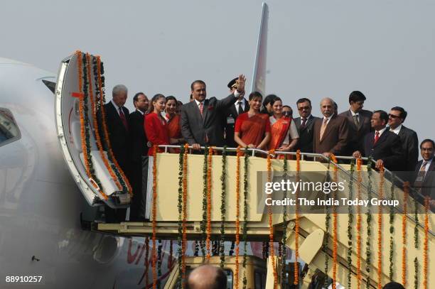 Praful Patel, Union Cabinet Minister for Civil Aviation pauses with Air India air hostesses with their new uniform during the delivery of the Boeing...