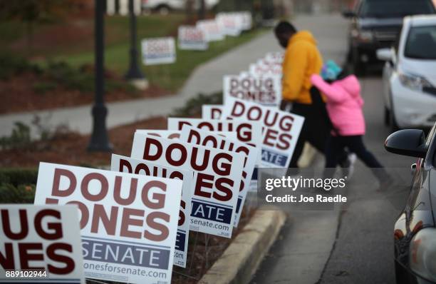 Campaign signs line the street as Democratic Senatorial candidate Doug Jones speaks during a campaign event held at Alabama State University at the...