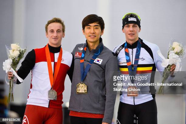 Livio Wenger of Switzerland, Seung-Hoon Lee of Korea and Bart Swings of Germany stand on the podium after the men's mass start final during day 2 of...