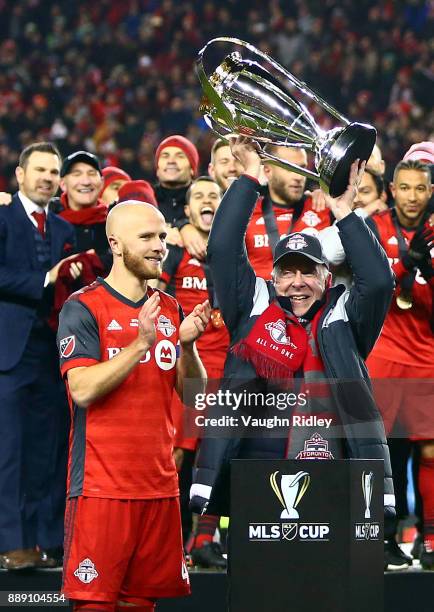 Michael Bradley of Toronto FC watches as owner Larry Tanenbaum lifts the Championship Trophy after winning the 2017 MLS Cup Final against the Seattle...