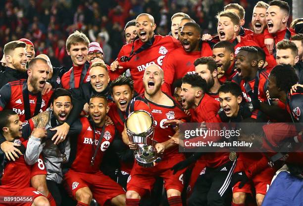 Michael Bradley of Toronto FC lifts the Championship Trophy after winning the 2017 MLS Cup Final against the Seattle Sounders at BMO Field on...