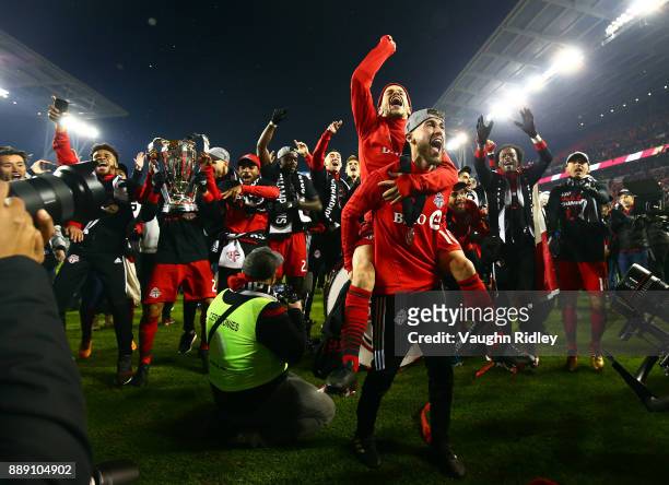 Jonathan Osorio and Sebastian Giovinco of Toronto FC celebrate after winning the 2017 MLS Cup Final against the Seattle Sounders at BMO Field on...