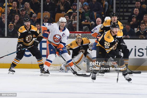 John Tavares of the New York Islanders watches the play against Kevan Miller, Tuukka Rask, Riley Nash and Zdeno Chara of the Boston Bruins at the TD...