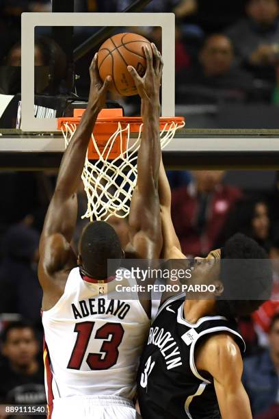 Brooklyn Nets' Jarrett Allen tries to stop Miami Heat's Bam Adebayo from dunking the ball, during an NBA Global Games match at the Mexico City Arena,...