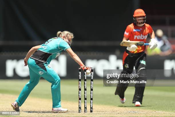 Delissa Kimmince of the Heat runs out Lauren Ebsary of the Scorchers during the Women's Big Bash League WBBL match between the Perth Scorchers and...