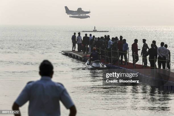 Quest Aircraft Co. Amphibious Kodiak plane, operated by SpiceJet Ltd., prepares to land on water during a demonstration flight event in Mumbai,...