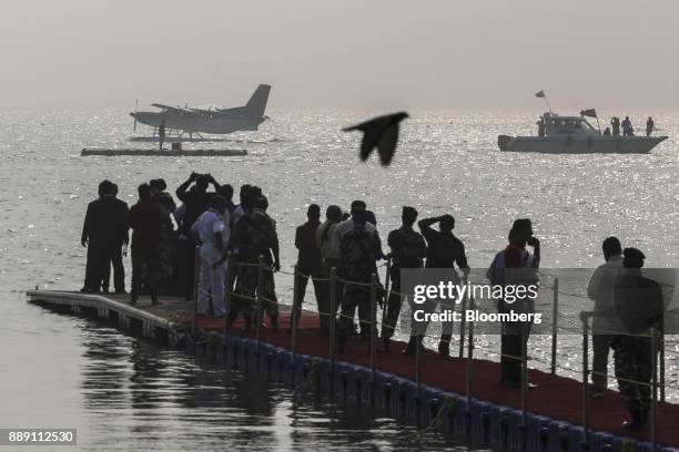 Quest Aircraft Co. Amphibious Kodiak plane, operated by SpiceJet Ltd., left, floats on water during a demonstration flight event in Mumbai, India, on...