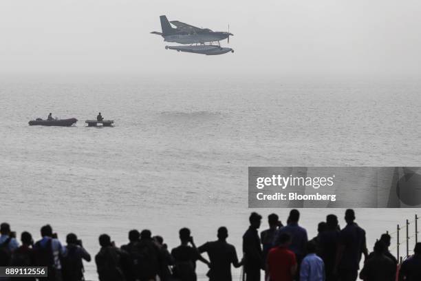 Quest Aircraft Co. Amphibious Kodiak plane, operated by SpiceJet Ltd., prepares to land on water during a demonstration flight event in Mumbai,...