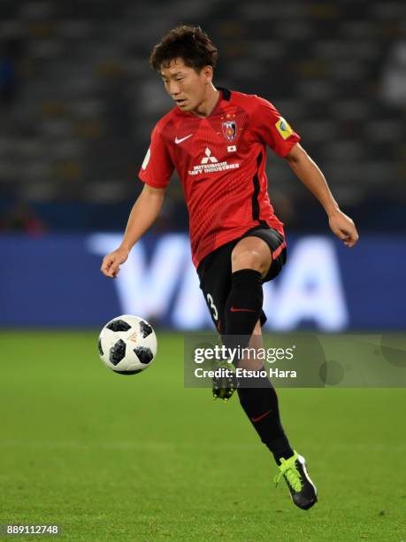 Tomoya Ugajin of Urawa Red Diamonds in action during the FIFA Club World Cup match between Al Jazira and Urawa Red Diamonds at Zayed Sports City...