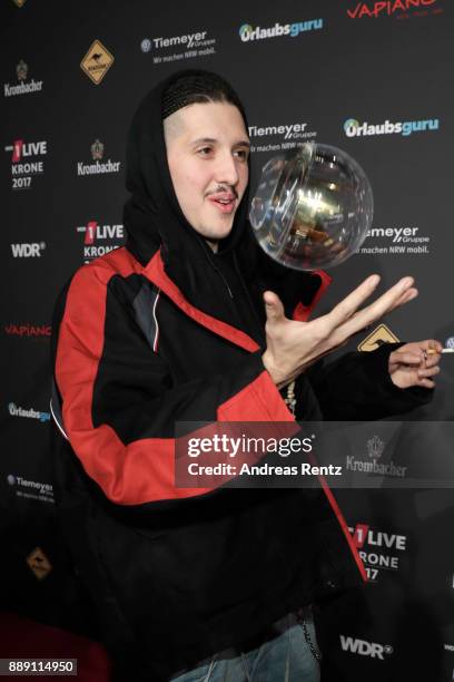 Poses with his awards during the 1Live Krone radio award at Jahrhunderthalle on December 07, 2017 in Bochum, Germany.