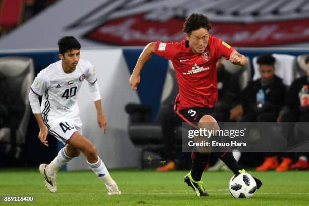 Tomoya Ugajin of Urawa Red Diamonds in action during the FIFA Club World Cup match between Al Jazira and Urawa Red Diamonds at Zayed Sports City...