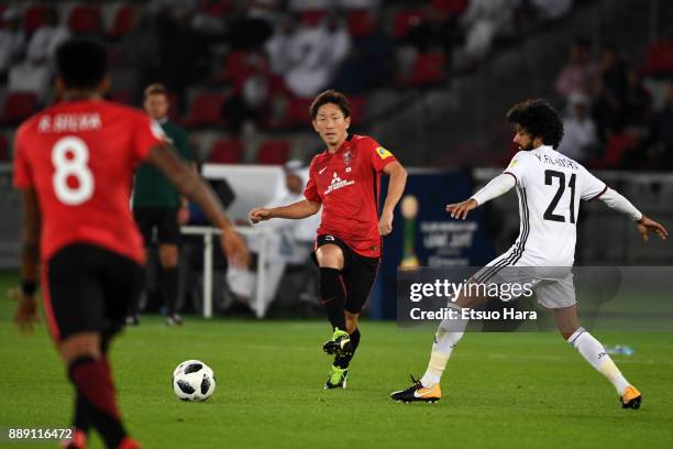 Tomoya Ugajin of Urawa Red Diamonds in action during the FIFA Club World Cup match between Al Jazira and Urawa Red Diamonds at Zayed Sports City...