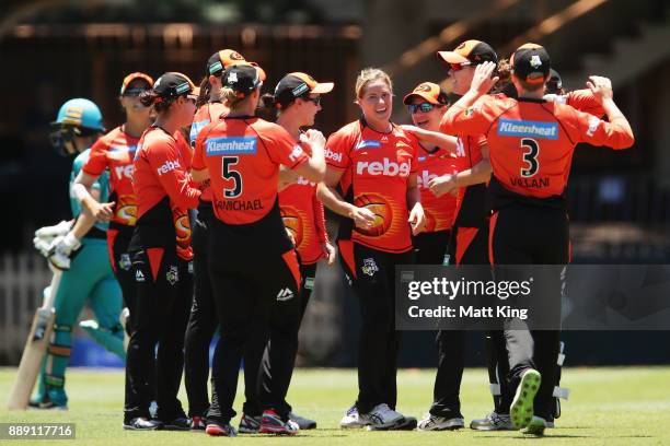 Katherine Brunt of the Scorchers celebrates with team mates after taking the wicket of Kirby Short of the Heat during the Women's Big Bash League...