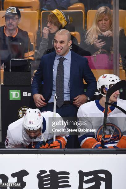 Assistant Coach Scott Gomez of the New York Islanders on the bench during the third period against the Boston Bruins at the TD Garden on December 9,...