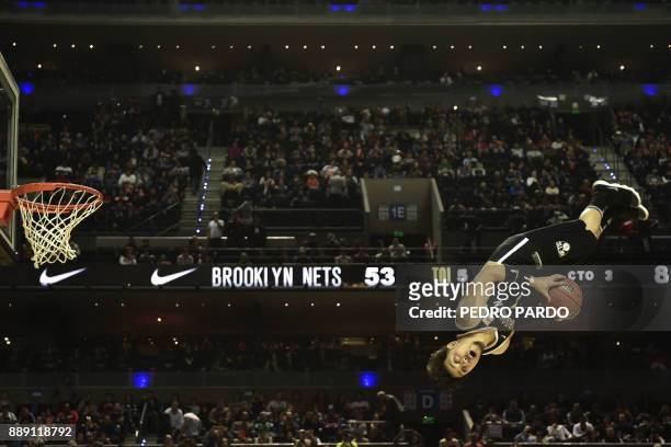 An animator performs at halftime in the NBA Global Games match Miami Heat against Brooklyn Nets, at Mexico City's Arena on December 9 in Mexico City....