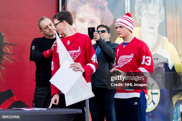 Darren McCarty signs autographs during the NHL Centennial Fan Arena on December 3, 2017 in Detroit, Michigan.