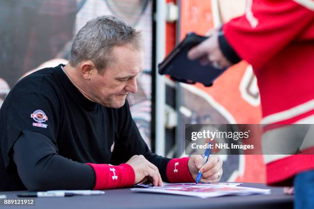 Darren McCarty signs autographs during the NHL Centennial Fan Arena on December 3, 2017 in Detroit, Michigan.