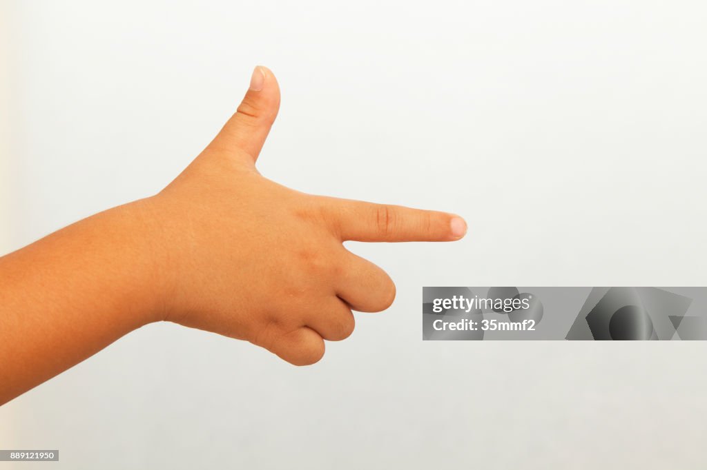 A child's hand pointing in the direction
