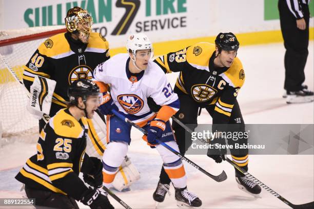 Anders Lee of the New York Islanders watches the play against Tuukka Rask and Zdeno Chara of the Boston Bruins at the TD Garden on December 9, 2017...