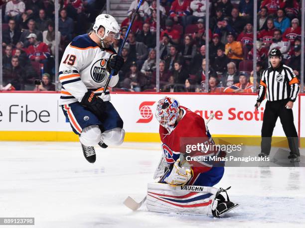 Patrick Maroon of the Edmonton Oilers jumps in front of goaltender Antti Niemi of the Montreal Canadiens during the NHL game at the Bell Centre on...