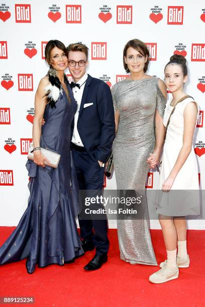 Gerit Kling with her son Leon and her sister Anja Kling with her daughter Alea attend the 'Ein Herz fuer Kinder Gala' at Studio Berlin Adlershof on...