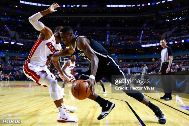 Caris Levert of Brooklyn Nets handles the ball against Wayne Ellington of Miami Heatduring the NBA game between the Brooklyn Nets and Miami Heat at...