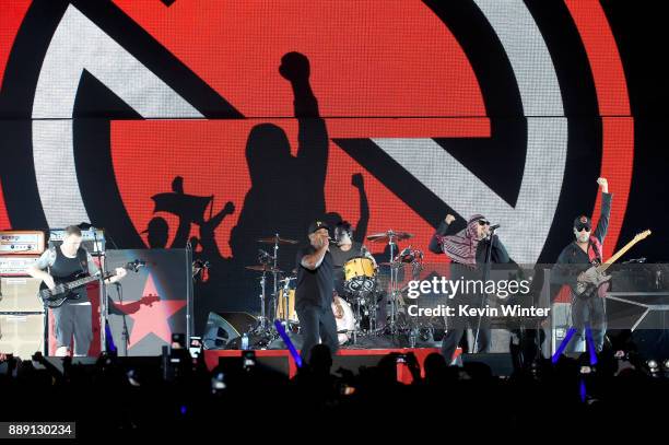 Tim Commerford, Chuck D, B-Real, Brad Wilk, B-Real and Tom Morello of Prophets of Rage perform onstage during KROQ Almost Acoustic Christmas 2017 at...