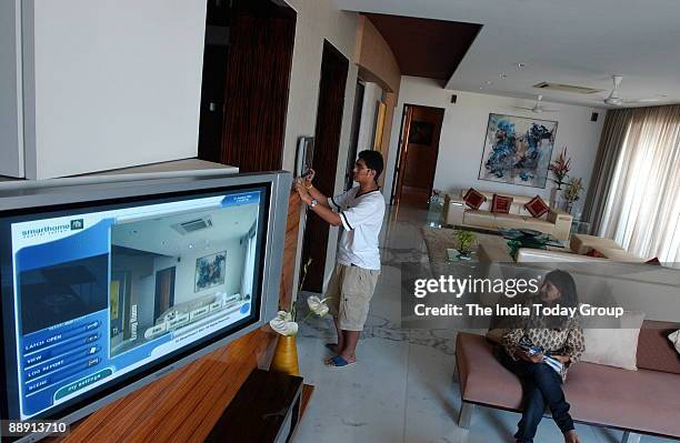 Riken Vora son of Heena Vora, controls his house through touch screen interphase in the Western Indian of City Of Mumbai .The touch screen help to...