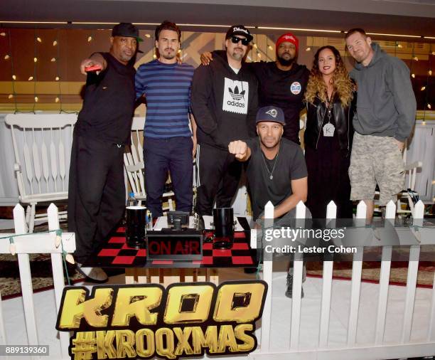 Chuck D, Brad Wilk, B-Real, Tom Morello, DJ Lord, KROQ DJ Nicole Alvarez and Tim Commerford of Prophets of Rage pose backstage during KROQ Almost...