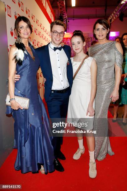 Gerit Kling, her son Leon, her sister Anja Kling and her daughter Alea attend the Ein Herz Fuer Kinder Gala reception at Studio Berlin Adlershof on...