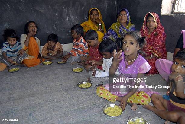 Pre School children having midday meal at Anganwadis in Jhalawar, Rajasthan, India
