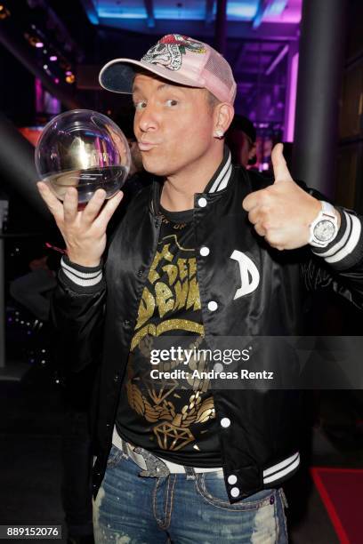 Dennis aus Huerth poses with his award at the after party of the 1Live Krone radio award at Jahrhunderthalle on December 07, 2017 in Bochum, Germany.