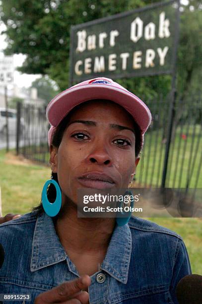 Tiffany Robinson stands outside the gate of Burr Oak Cemetery hoping to receive information about her cousin's grave July 8, 2009 in Alsip, Illinois....