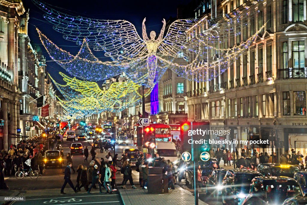 Christmas lights and crowds of shoppers. On Regents Street London.