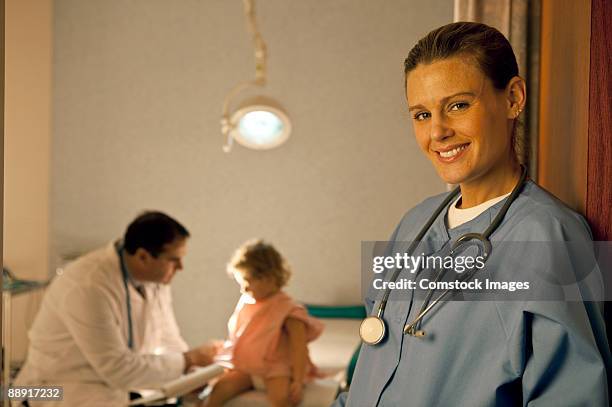 nurse with doctor in the background - take care new york screening stockfoto's en -beelden