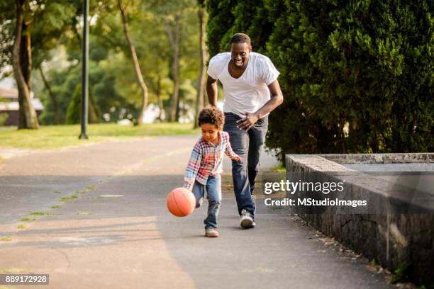 playing basketball. - family health club stock pictures, royalty-free photos & images