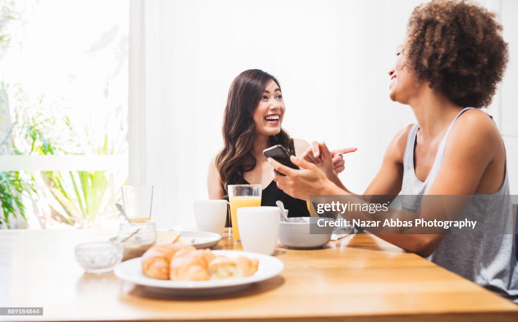 Two friends enjoying breakfast together.