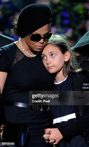 Singer Janet Jackson and Michael Jackson's daughter Paris Katherine Jackson hug onstage during the Michael Jackson public memorial service held at...