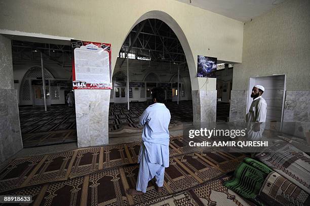 In this photograph taken on July 8 a Pakistani Muslim reads the will of late Red Mosque deputy chief Abdul Rashid Ghazi, the younger brother of chief...