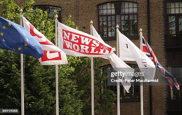 News of The World flag flies amongst others at the News International printing plant at Wapping on July 9, 2009 in London. The Metropolitan Police...