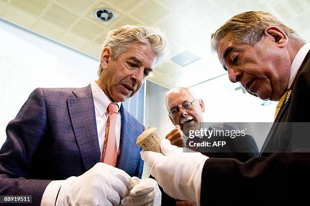 Dutch minister of education Ronald Plasterk hands over an historical treasure, an brick-clay fragment with inscription from Nebukadnezar , to Iraqi...