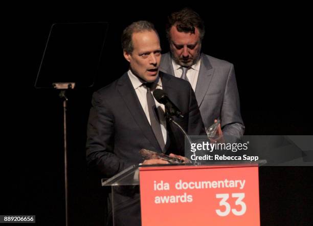 Sebastian Junger and Nick Quested accept the Courage Under Fiere Award at the 33rd Annual IDA Documentary Awards at Paramount Theatre on December 9,...