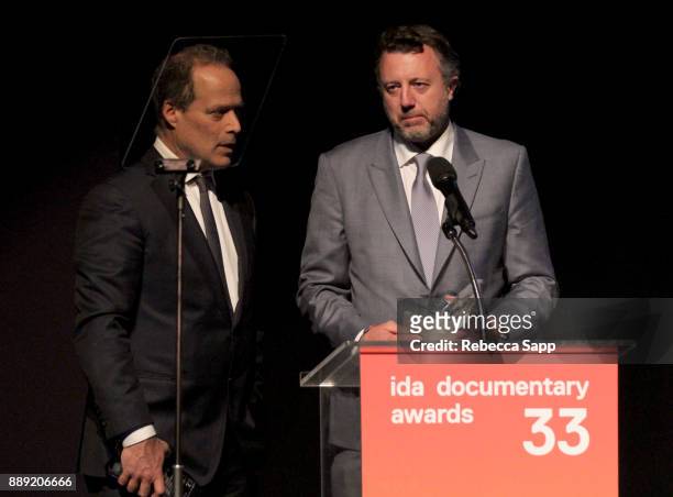 Sebastian Junger and Nick Quested accept the Courage Under Fiere Award at the 33rd Annual IDA Documentary Awards at Paramount Theatre on December 9,...