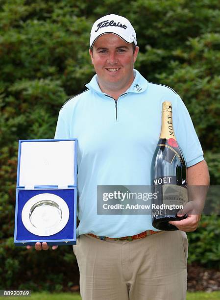 Shane Lowry of Ireland receives his European Tour Golfer of the Month award for May during the First Round of The Barclays Scottish Open at Loch...