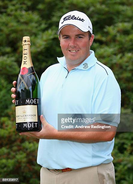 Shane Lowry of Ireland receives his European Tour Golfer of the Month award for May during the First Round of The Barclays Scottish Open at Loch...