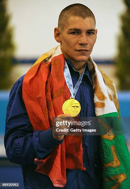Gold medalist Domenico Valentino of Italy poses with her medal on the podium during the medal ceremony Men's Light 60kg final on day 6 during the XVI...